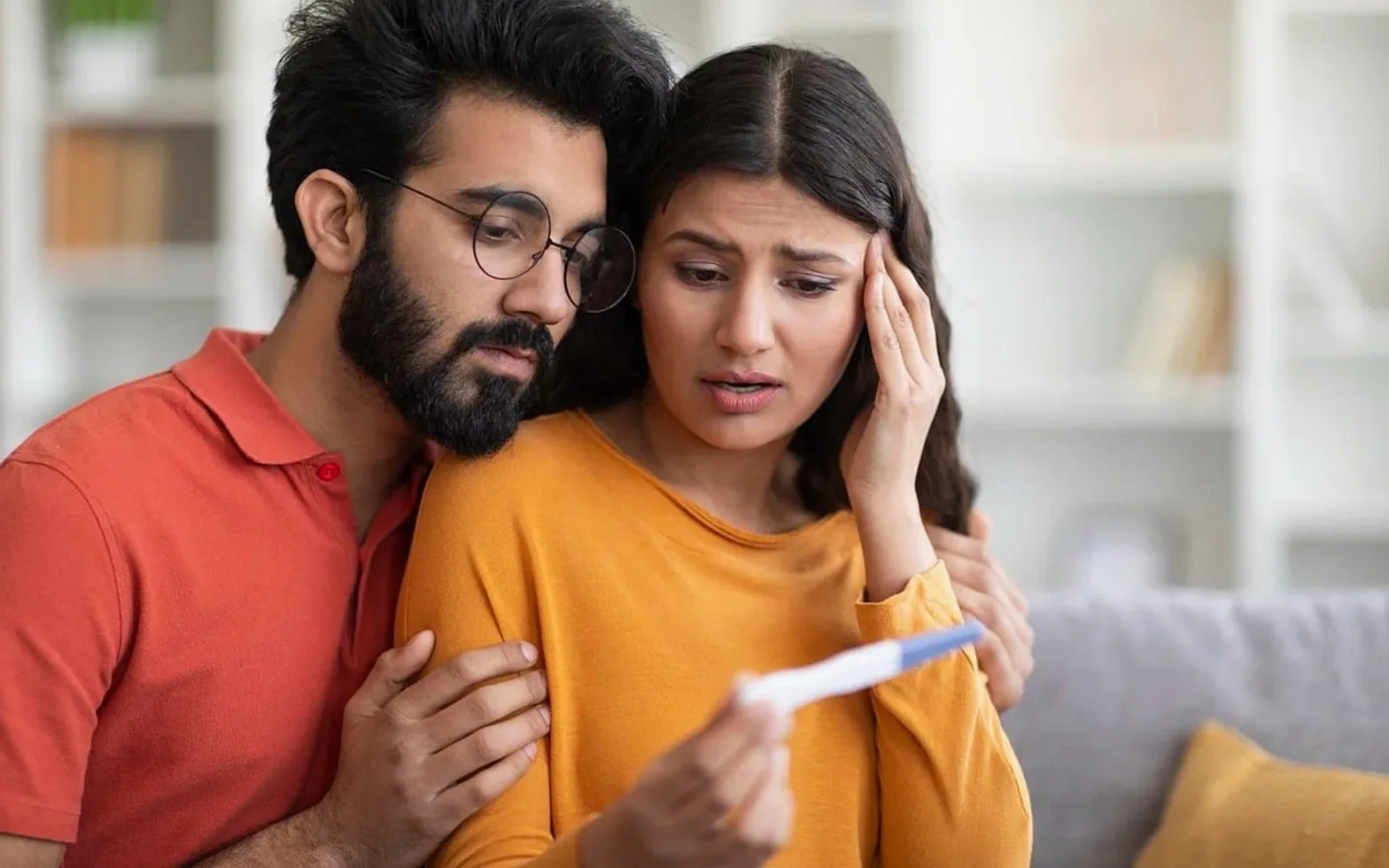 Pregnancy test, couple and concern